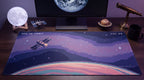 AFK in Orbit pixel art desk mat on a desk at night