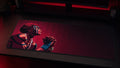 Akaza anime desk mat in a red-black PC setup