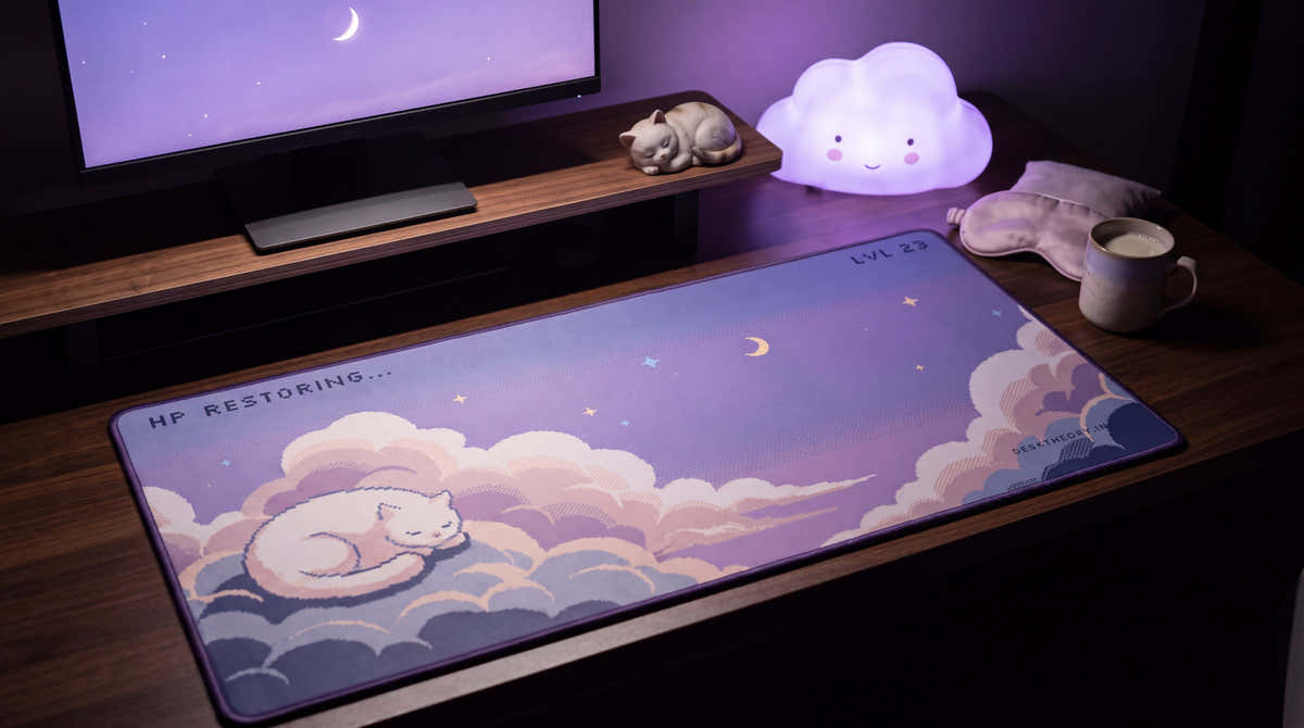 HP Restoring... pixel art desk mat on a desk at night