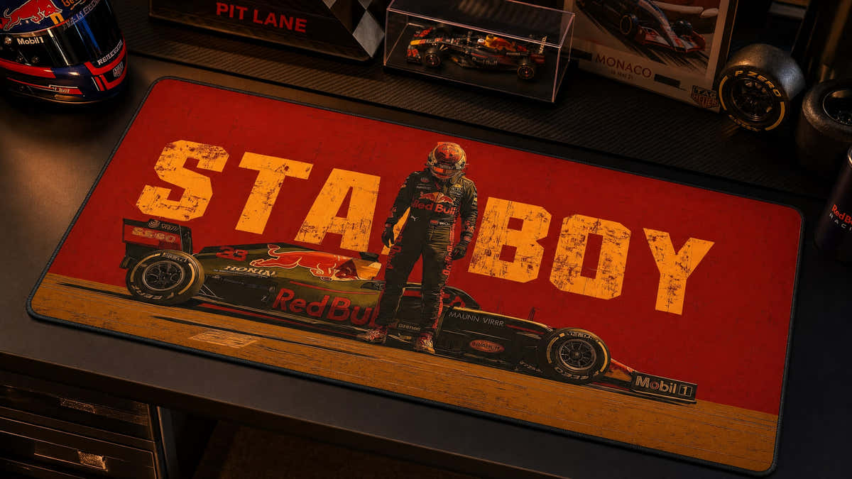 STABOY Grand Prix desk mat in a warm motorsport collector desk setup