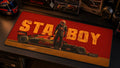 STABOY Grand Prix desk mat in a warm motorsport collector desk setup