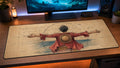 Monkey D. Luffy anime desk mat in a blue-lit PC setup