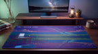 Very Remote Work pixel art desk mat on a desk at night