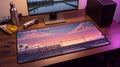 Window Seat: Monsoon pixel art desk mat on a desk at night